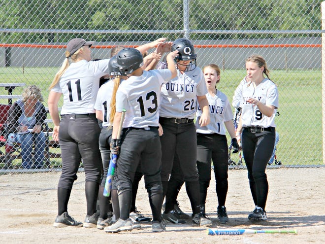 The Quincy Orioles welcome senior teammate Hannah Economou to home plate after her second home run of the game Monday versus Addison.

TROY TENNYSON PHOTO