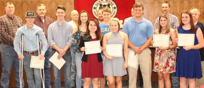 Among those recognized during Monday night's Glen Rose ISD Board of Trustees meeting were the top 10 scholastically ranked students in the Class of 2017. They included (from left) Cameron Rush, Joel Sims, Hannah Andrews, Wendy Lin (in front), Seth Love, Kaley Shaw (in front), Matt Willis, Brittany Rosentreter and Cassi Niedziela. Sophie Bozarth was unable to attend. The board members are on the back row.