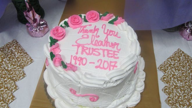 A pink and white cake spells the message to "Eleanor" and was a hit with her colleagues that joined her.