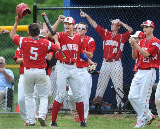 Souderton's Jack Despain (left) is celebrates with Thylar Summarell after scoring the game's first run against Neshaminy in a District One Class 6A baseball game on Wednesday, May 24,2017.