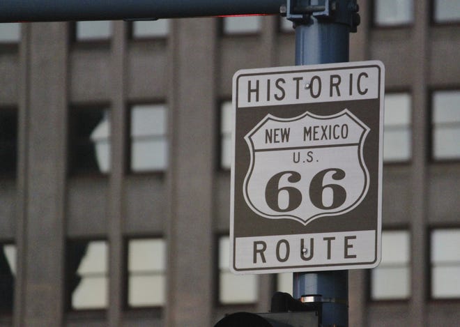 this file photo shows one of the signs along historic Route 66 in downtown Albuquerque, N.M. Route 66, the historic American roadway that linked Chicago to the West Coast, soon may be dropped from a National Park Service preservation program. A federal law authorizing the Route 66 Corridor Preservation Program is set to expire in two years and with it would go millions of dollars in grants for reviving old tourist spots in struggling towns. [Susan Montoya Bryan/AP]
