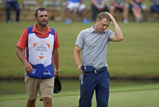 Jordan Spieth rubs his head after he finished the second round of the Byron Nelson golf tournament at TPC Four Seasons Resort Friday in Irving, Texas. [JAE S. LEE / THE DALLAS MORNING NEWS VIA AP]