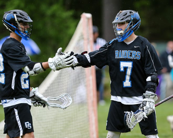 Dover-Sherborn's Bailey Laidman (right), pictured during the Raiders' 18-8 win over Hopkinton on Monday, had eight goals to lead D-S to a 16-15 OT win over Franklin on Wednesday. [Daily News and Wicked Local File Photo/Dan Holmes]