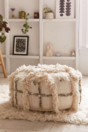 This undated photo provided by Urban Outfitters shows a Moroccan-inspired pouf from Urban Outfitters which sports a shaggy trim, sequins and a geometric motif.

[Urban Outfitters/www.urbanoutfitters.com via AP]