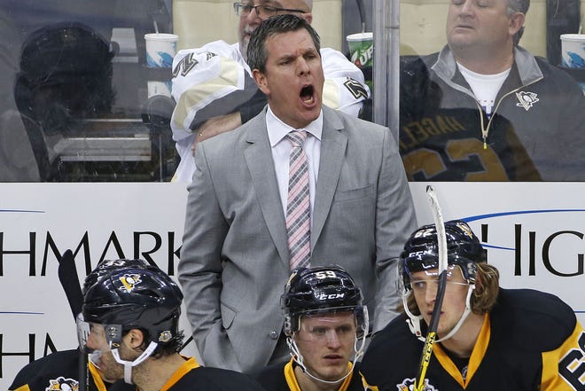 Penguins coach Mike Sullivan expresses himself to an official during the third period against the Buffalo Sabres on March 5 in Pittsburgh.