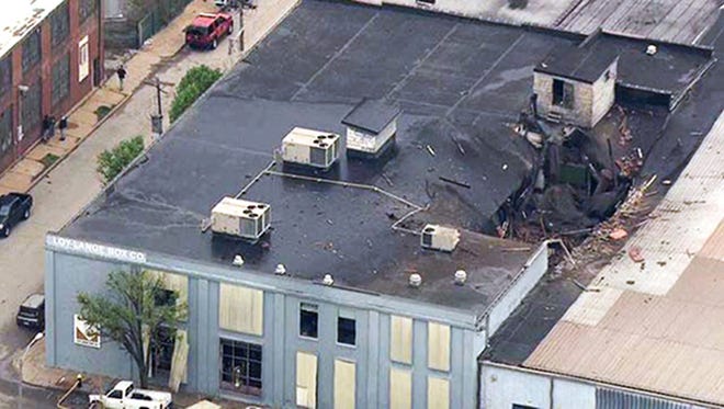 This image from video provided by KMOV shows damage to the roof of the Loy-Lange Box Co. in St. Louis after a steam condensation tank exploded and flew before crashing through the roof of a nearby laundry business on April 3. The U.S. Chemical Safety and Hazard Investigation Board released in findings Thursday of its investigation into the explosion that killed several people. [KMOV via AP, File]