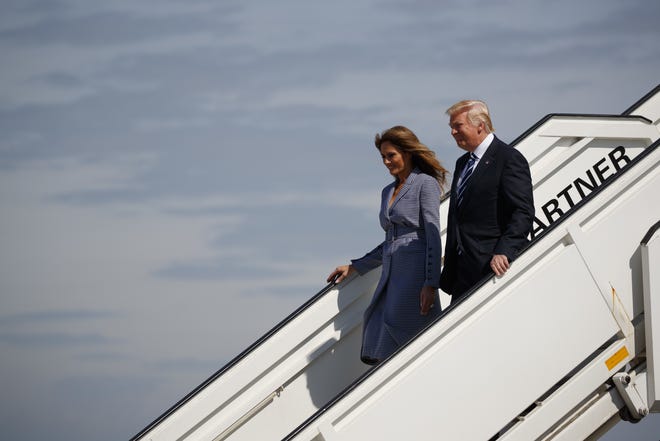 President Donald Trump and first lady Melania Trump walk off Air Force One after arriving at Brussels International Airport, Wednesday, May 24, 2017, in Brussels. THE ASSOCIATED PRESS