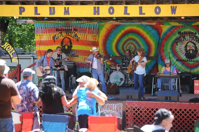 The annual Plum Hollow Festival will be held beginning Thursday through Saturday in New Prospect. In this photo, Bill Noonan and the Barbed Wires play for the crowd. [File photo]