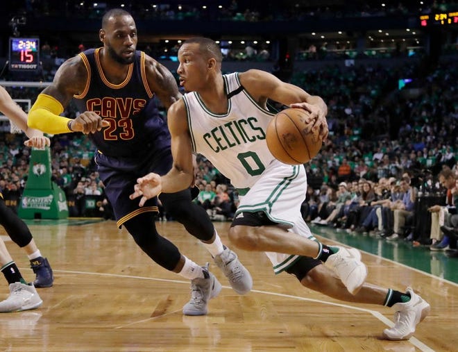Celtics guard Avery Bradley drives against the Cavaliers' LeBron James during the first half of Game Five on Thursday.