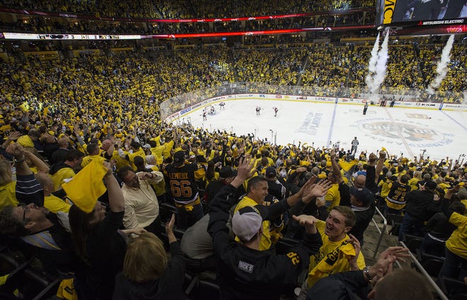 Fans celebrate after the Pittsburgh Penguins' 3-2 double-overtime win over the Ottawa Senators in Game 7 of the Eastern Conference final Thursday at PPG Paints Arena in Pittsburgh.
