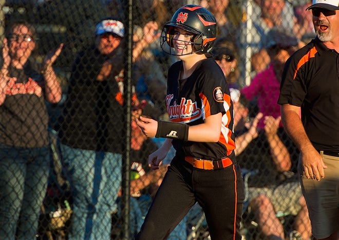 North Davidson's Autumn Stover smiles rounding third base as she sees her teammates waiting at home plate to celebrate after Stover hit a solo home run against Richmond County in the third inning on Friday. [Donnie Roberts/The Dispatch]