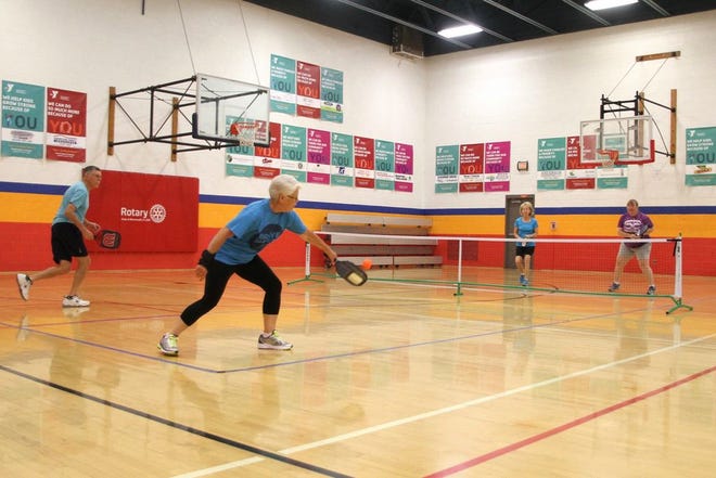 From left, Greg McClintock, Judy Andrews and Susan Jargons, all of Monmouth, and Cathy Gibson of Viola, participate in Thursday morning Warren County YMCA pickleball league.