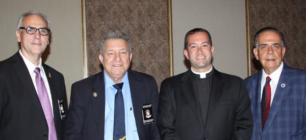 From left, Fall River Chapter of the Prince Henry Society President Robert C. Medeiros, Spring Scholarship Concert Committee Chair Feliciano Freitas, Rev. Jay Mello and State Representative Alan Silvia.