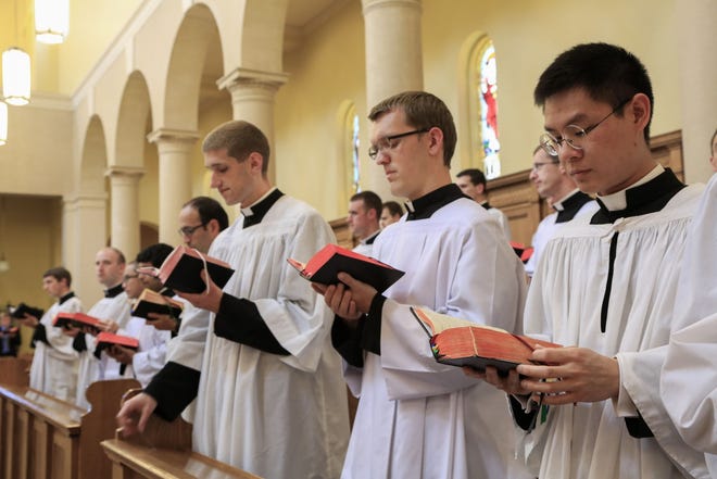 Members of the Priestly Fraternity of St. Peter, a Catholic order formed in 1988, perform a Gregorian chant at Our Lady of Guadaloup seminary in Denton, Neb. The seminarians released an album, "Requiem," singing a traditional Latin funeral Mass. [The Associated Press]