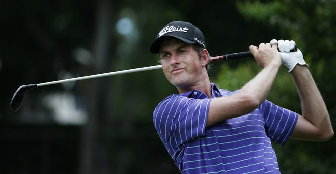Webb Simpson watches his tee shot on the eighth hole during the third round of the Dean & DeLuca Invitational on Saturday. [The Associated Press]
