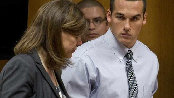 Greg Kelley and his attorney during his 2014 child sex assault trial.