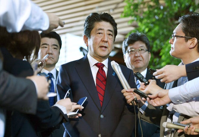 Japanese Prime Minister Shinzo Abe, center, answers to a reporter’s question about North Korea’s missile launch, at his official residence in Tokyo Monday morning, May 29, 2017. North Korea on Monday fired an apparent ballistic missile off its east coast that landed in the waters of Japan’s economic zone, South Korean and Japanese officials said, the latest in a string of recent test launches as the North seeks to build nuclear-tipped ICBMs that can reach the U.S. mainland. (Muneyuki Tomari/Kyodo News via AP)