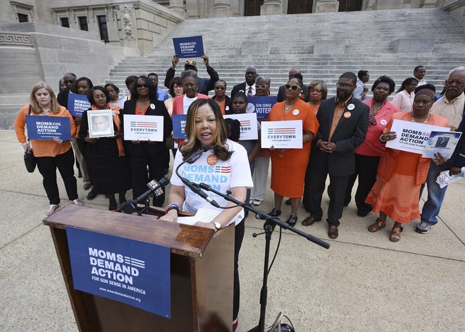 Lucy McBath, national spokeswoman for Moms Demand Action for Gun Sense in America, is joined in March 2016 by faith leaders, gun violence survivors and others on the south steps of the Mississippi State Capitol in Jackson, Miss. McBath is afraid many more people will die if Florida Gov. Rick Scott signs a bill making it harder to prosecute when people claim they commit violence in self defense. [Joe Ellis/The Clarion-Ledger via AP, File]
