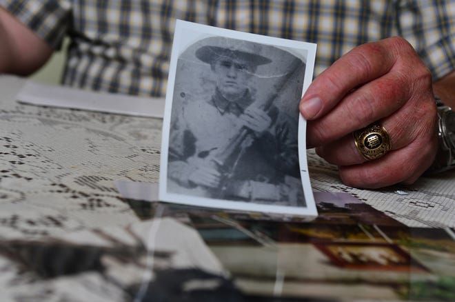 James R. Gosnell shows a picture of his great uncle, Willard Robinson, who served in the S.C. National Gurard during the World War I era. Robinson is buried in Arcadia Cemetery in Spartanburg County. [ALEX HICKS JR./SPARTANBURG HERALD-JOURNAL]