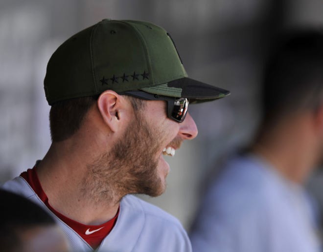 Boston Red Sox pitcher Chris Sale jokes with teammates in the dugout before a baseball game against the Chicago White Sox, Monday, May 29, 2017, in Chicago. Sale received a warm welcome in his return to Chicago on Monday following his trade to Boston last winter. [PAUL BEATY/AP PHOTO]