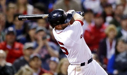 Red Sox second baseman Dustin Pedroia, shown following through on a two-run single against the Rangers on May 24, will get an MRI on the left wrist he injured in 5-4 loss to the White Sox on Monday. [AP Photo/Charles Krupa]
