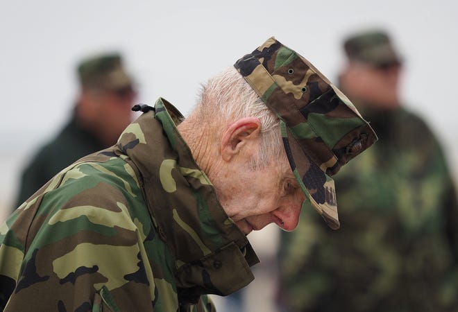 World War II veteran Warren White 87, bows his head during the American Legion Post 35's Hampton area Memorial Day ceremony Monday, at Hampton Beach.

[Rich Beauchesne/Seacoastonline]
