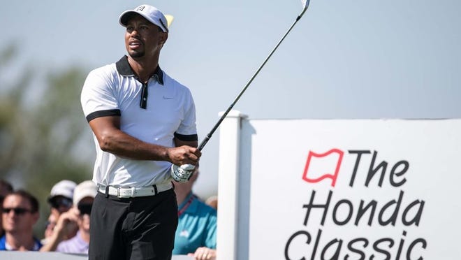Tiger Woods hits on the 9th hole during The Honda Classic Gold Pro-Am in Palm Beach Gardens, Florida on February 25, 2014. The start was delayed 1 hour and 45 minutes. (ALLEN EYESTONE / THE PALM BEACH POST)