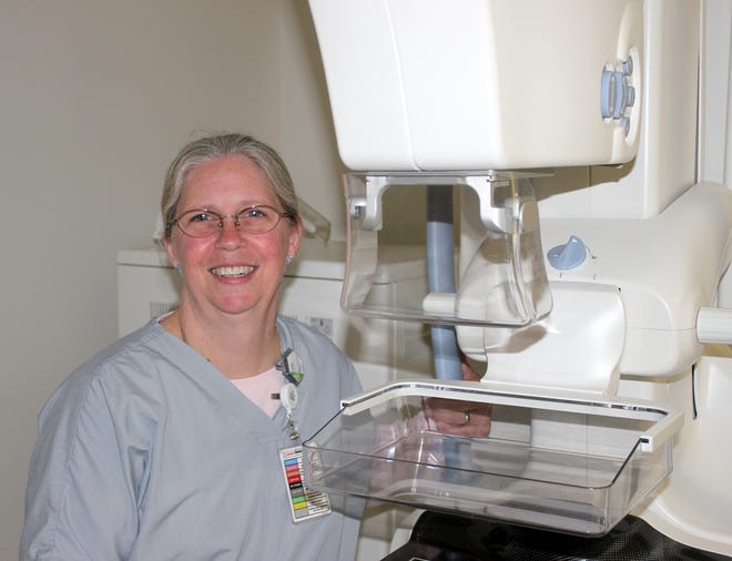 Bonnie Shaffer, lead mammographer, at Hillsdale Hospital stands besides the hospitals mammography machine. The hospital recently received accreditation from the American College of Radiology. 

[COURTESY PHOTO]