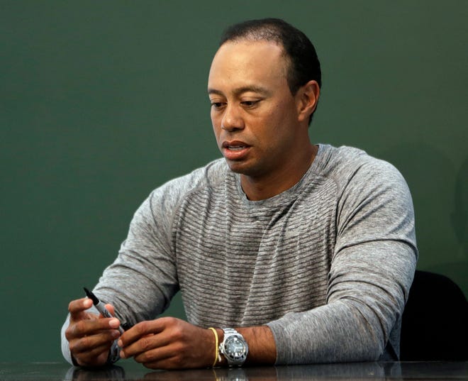 In this March 20, 2017, file photo, golfer Tiger Woods prepares to sign copies of his new book at a book signing in New York. Police say golf great Tiger Woods has been arrested on a DUI charge in Florida.

The Palm Beach County Sheriff's Office says on its website that Woods was booked into a county jail around 7 a.m. on Monday, May 29, 2017. THE ASSOCIATED PRESS