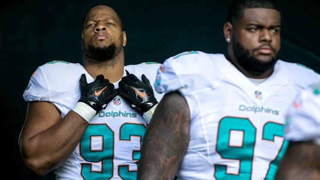 Miami Dolphins defensive tackle Ndamukong Sun (93) and Miami Dolphins defensive tackle Jordan Phillips (97) wait to enter field against the Pittsburgh Steelers at Hard Rock Stadium in Miami Gardens, Florida on October 16, 2016. (Allen Eyestone / The Palm Beach Post)