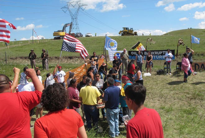 FILE - In this Aug. 12, 2016, file photo, Native Americans protest the Dakota Access oil pipeline near the Standing Rock Sioux Reservation in southern North Dakota. A weekend film festival on the reservation aims to bolster the anti-pipeline movement that blossomed there last year. Another goal of the inaugural Standing Rock Nation Film and Music Festival at the tribal casino near Fort Yates, N.D., beginning Friday, June 2, 2017, is to foster connections between the Native American community and the film industry. (AP Photo/James MacPherson, File)