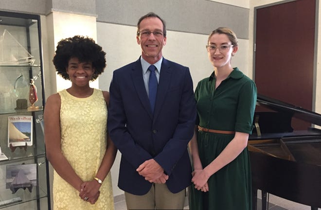 New Bedford Symphony Orchestra President and CEO David Prentiss with scholarship recipients Sarah Nichols (left) and Ashley Perry. SUBMITTED