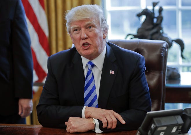 In this March 24, 2017, file photo President Donald Trump speaksin the Oval Office of the White House in Washington. Trump has been handing out his cellphone number to world leaders and urging them to call him directly, an unusual invitation that breaks diplomatic protocol and is raising concerns about the security and secrecy of the U.S. commander in chief's communications. THE ASSOCIATED PRESS