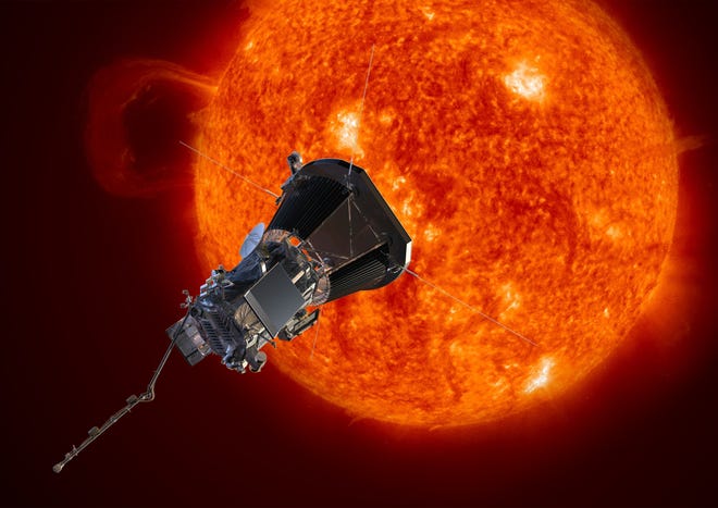 This image made available by the Johns Hopkins University Applied Physics Laboratory on Wednesday, May 31, 2017 depicts NASA's Solar Probe Plus spacecraft approaching the sun. On Wednesday, NASA announced it will launch the probe in summer 2018 to explore the solar atmosphere. It will be subjected to brutal heat and radiation like no other man-made structure before. (Johns Hopkins University Applied Physics Laboratory via AP)