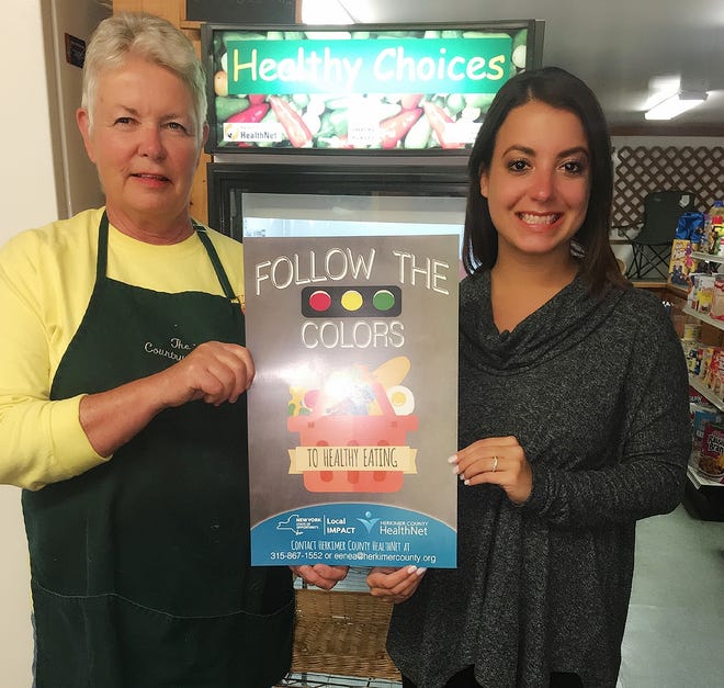 From left are Nancy Carlson, owner of Salisbury Country Store, and Elyse Enea, program coordinator for Herkimer County HealthNet. Walk into a convenience store in Herkimer County and you might see signs of good health. Literally. It’s part of a HealthNet program called the Healthy Store Initiative that’s meant to draw customers’ attention to certain products. [SUBMITTED PHOTO]