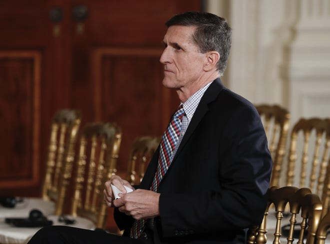 In this Feb. 10, 2017, file photo, then - National Security Adviser Michael Flynn sits in the front row before the start of the President Donald Trump and Japanese Prime Minister Shinzo Abe news conference in the East Room of the White House, in Washington. The House intelligence committee said May 31, it is issuing subpoenas for President Donald Trump's former national security adviser and his personal lawyer as well as their businesses as part of its investigation into Russian activities during last year's election. THE ASSOCIATED PRESS