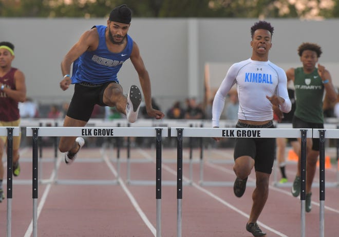 Sierra's Bikram Thiara, left, Kimball's Deion Lightfoot-Shelton, second from right, and St. Mary's Jamar Marshall, right, compete in the Sac-Joaquin Section Masters 300-meter hurdles finals on Friday at Elk Grove High. [CLIFFORD OTO/THE RECORD]