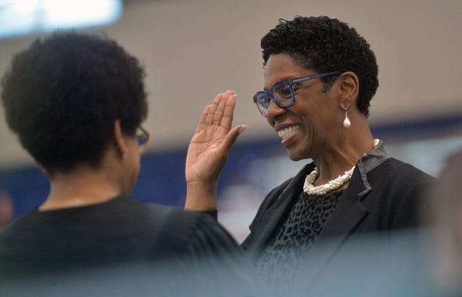 Ann Levett, right, is sworn in as school superintendent by Chief Judge Tammy Stokes at a ceremony at Beach High School. (Steve Bisson/Savannah Morning News)
