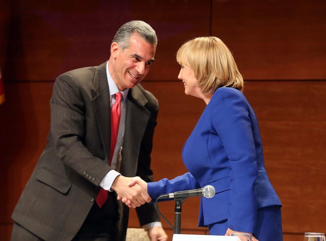Assemblyman Jack Ciattarelli and Lt. Gov. Kim Guadagno shake hands after their first primary debate Tuesday, May 9, 2017, at Stockton University in Galloway.