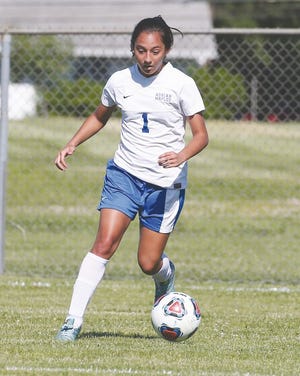 Adrian High School junior Vanessa Hernandez controls the ball in Thursday’s Division 2 district semifinal game against Chelsea. The Maples lost to the Bulldogs, 5-1.