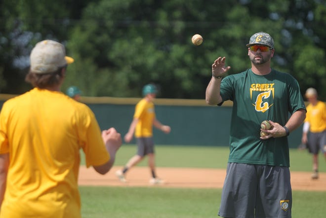 Crest baseball assistant coach Brandon Powell at practice on Tuesday afternoon as Chargers prepare for playing best-of-three series starting Friday at Five County Stadium in Zebulon for the 3A state championship. [Hannah Dunaway/ The Star]