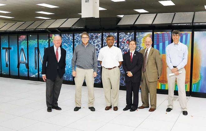 Thomas Zacharia, third from left, will be the new director of Oak Ridge National Laboratory. This photo was taken during a recent visit by U.S. Energy Secretary Rick Perry, second from left, to ORNL. From left are U.S. Sen. Lamar Alexander, Perry, Zacharia, U.S. Congressman Chuck Fleischmann, University of Tennessee President Joe DiPietro and ORNL Director Thom Mason at the Titan supercomputer at ORNL.
