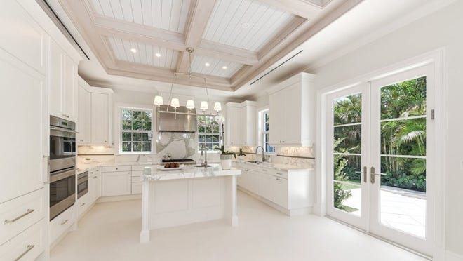Developer Lisa Erdmann of Lisa Erdmann Associates designed the interiors of a new spec house at 204 Jamaica Lane, which includes a kitchen with a detailed ceiling. Photo by VHT Studios, courtesy of the Corcoran Group