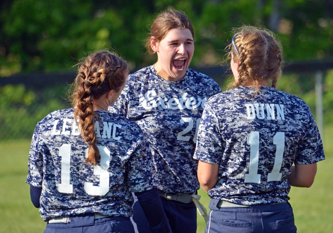 Exeter senior Mary O'Donnell (facing) reacts with teammates following Wednesday's 11-4 playoff win over Winnacunnet. [Ryan O'Leary/Seacoastonline]