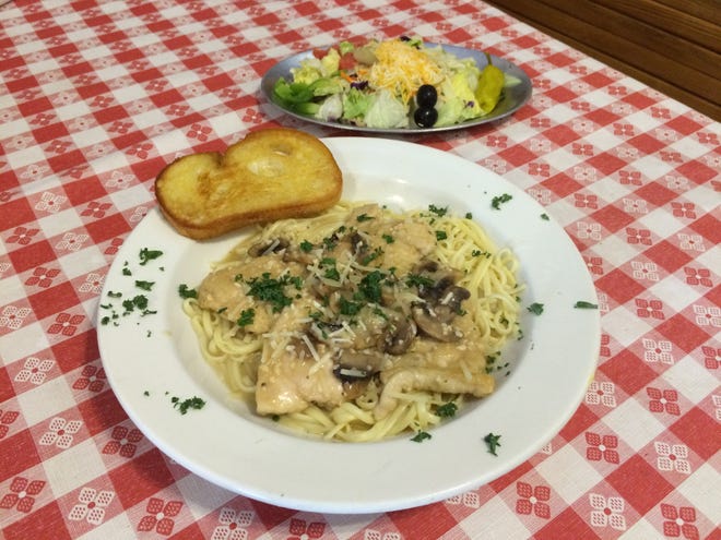 Chicken Marsala is served over linguine with garlic bread and Italian salad at Simple Comforts. [JAN WADDY/THE NEWS HERALD]