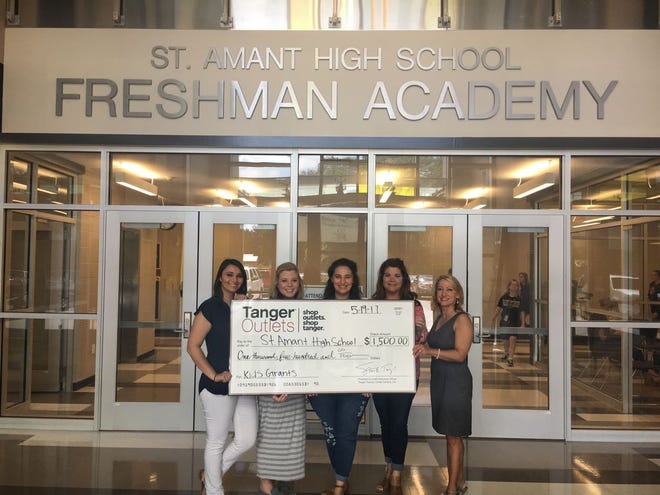 Tanger Outlets Office Administrator Katelynn Fontenot, teachers Courtney Vincent and Selby Boriel, Principal Mia Edwards, Tanger Outlets General Manager Jeanne St. Germain