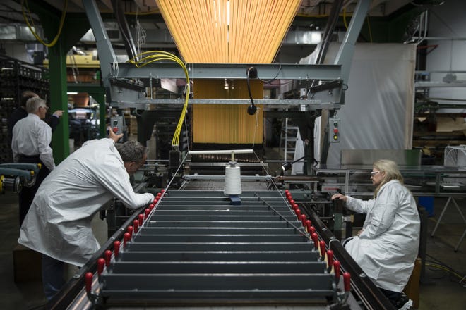 In this Thursday, March 23, 2017, file photo, workers manufacture thermal protection systems for NASA at Bally Ribbon Mills in Bally, Pa. U.S. employers pulled back on hiring in May 2017 by adding only 138,000 jobs. Hiring was still enough to help keep pushing unemployment lower. (AP Photo/Matt Rourke, File)
