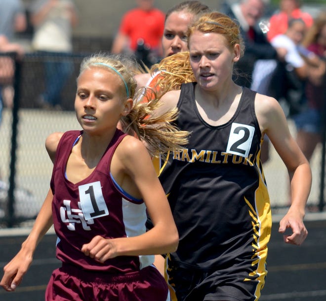 Holland Christian's Kayla Windemuller, left, and Hamilton's Erika Freyhof have proven to be the top two distance runners in the state. [Dan D'Addona/Sentinel staff]