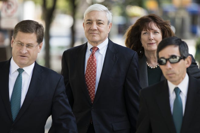 Former Penn State President Graham Spanier, center, arrives for his sentencing hearing at the Dauphin County Courthouse in Harrisburg, Pa., Friday, June 2, 2017. THE ASSOCIATED PRESS