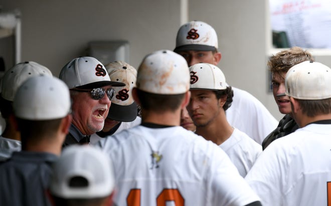 Sarasota Sailors coach Clyde Metcalf tries to get his team fired up at the start of the fifth inning of the team's Class 8A semifinal game against Oviedo Hagerty High School on Friday, June 2, 2017 in Ft. Myers. [Herald-Tribune staff photo / Mike Lang]